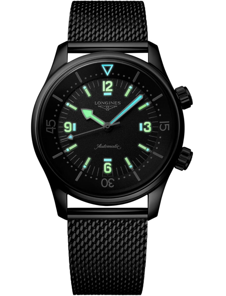 Night view of Longines Legend Diver 59 wristwatch with stainless steel case and bracelet, and black grained dial.
