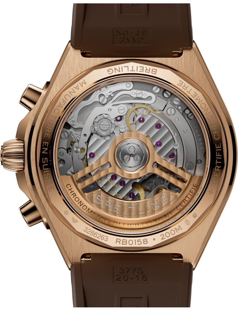 Back view of Breitling Chronomat B01 42 wristwatch with 18k red gold case, brown rubber strap, and 