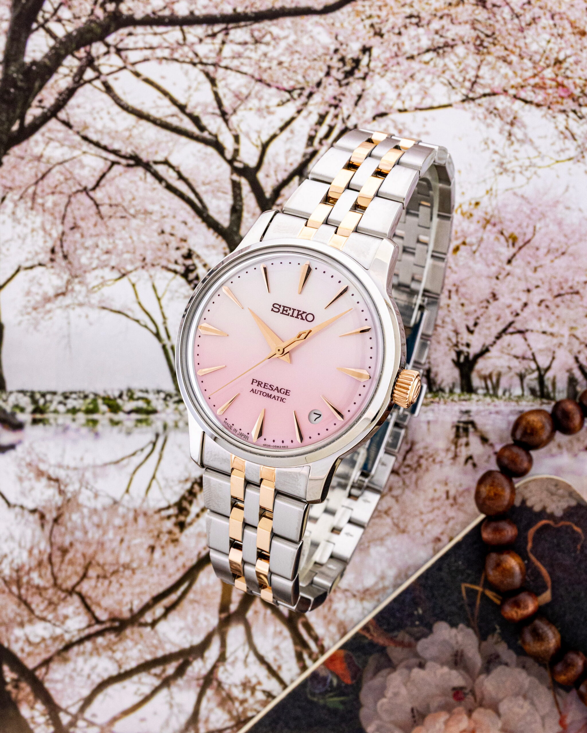 Hotlist image for Seiko Presage Cocktail Time wristwatch with stainless steel case and bracelet, and pink mother of pearl dial.