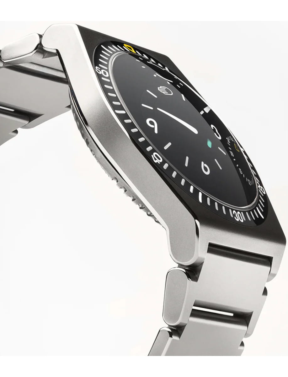 Right side view of Ressence TYPE 7 B wristwatch with Grade 5 titanium case and bracelet, and black dial.