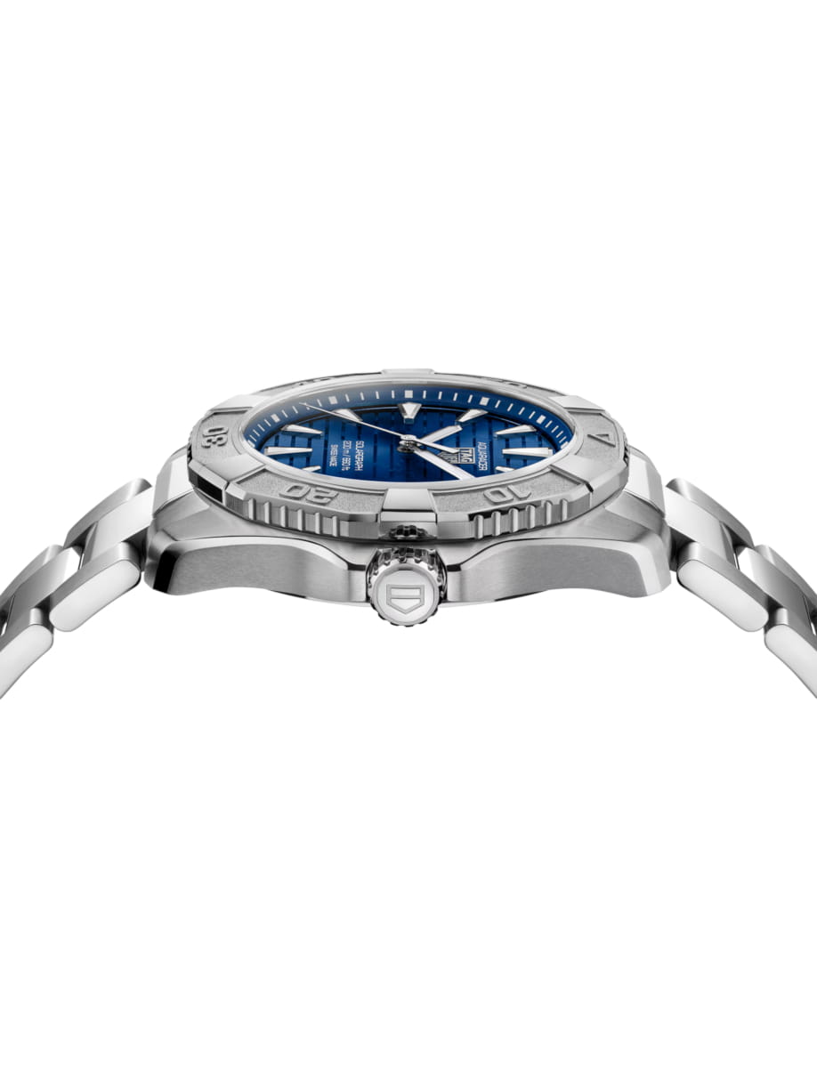 Side view of TAG Heuer wristwatch with stainless steel case and bracelet and blue dial