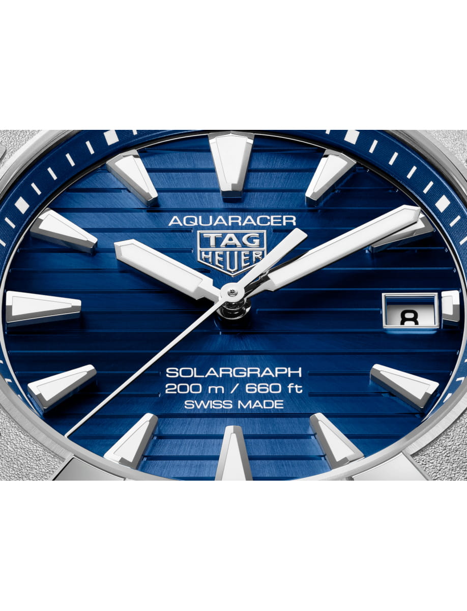 Close view of TAG Heuer wristwatch with stainless steel case and bracelet and blue dial