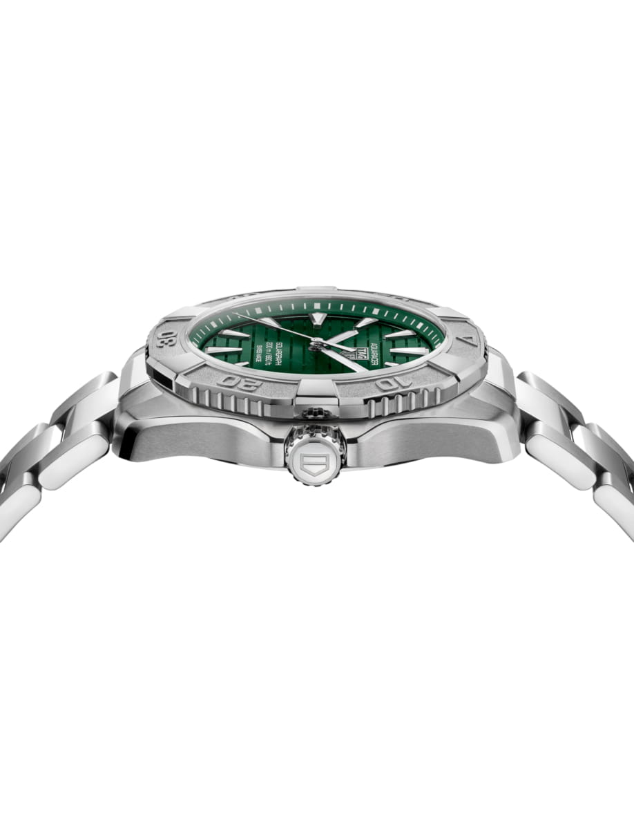 Side view of TAG Heuer wristwatch with stainless steel case and bracelet and green dial