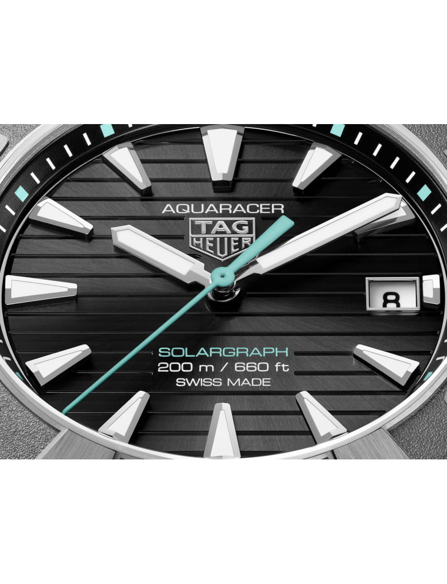 Close view of TAG Heuer wristwatch with titanium case and bracelet and black dial