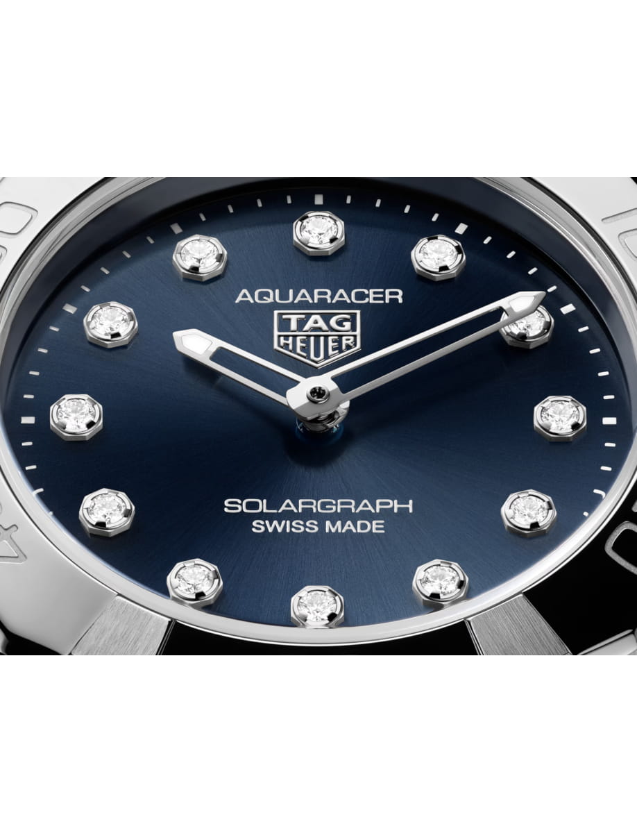 Close view of TAG Heuer wristwatch with stainless steel case and bracelet and blue dial