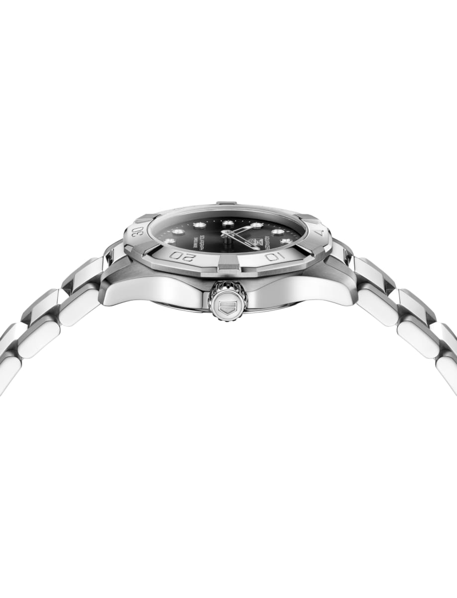 Side view of TAG Heuer wristwatch with stainless steel case and bracelet and black dial