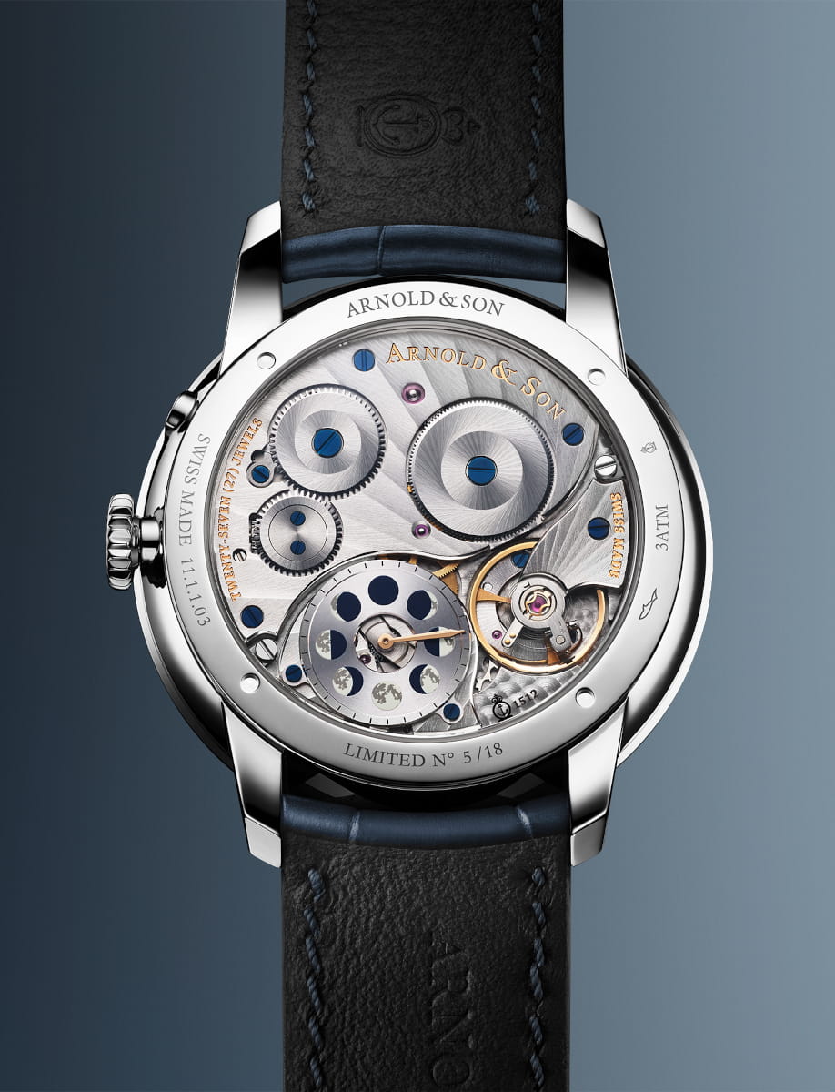 Back view of Arnold&Son Perpetual Moon wristwatch with stainless steel case, blue dial, and blue alligator leather.