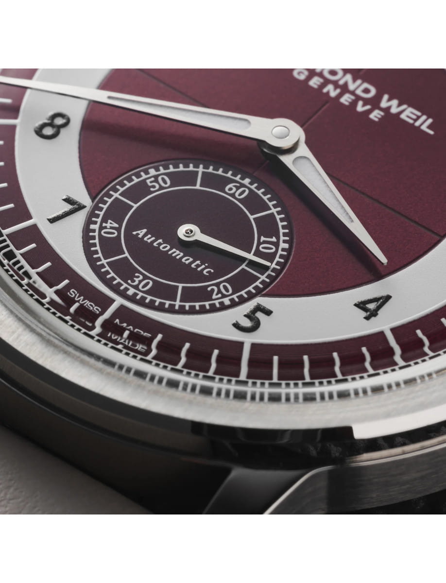 Dial view of Raymond Weil Millesime wristwatch with stainless steel case, red grape and shiny white dial, and beige genuine calf leather.