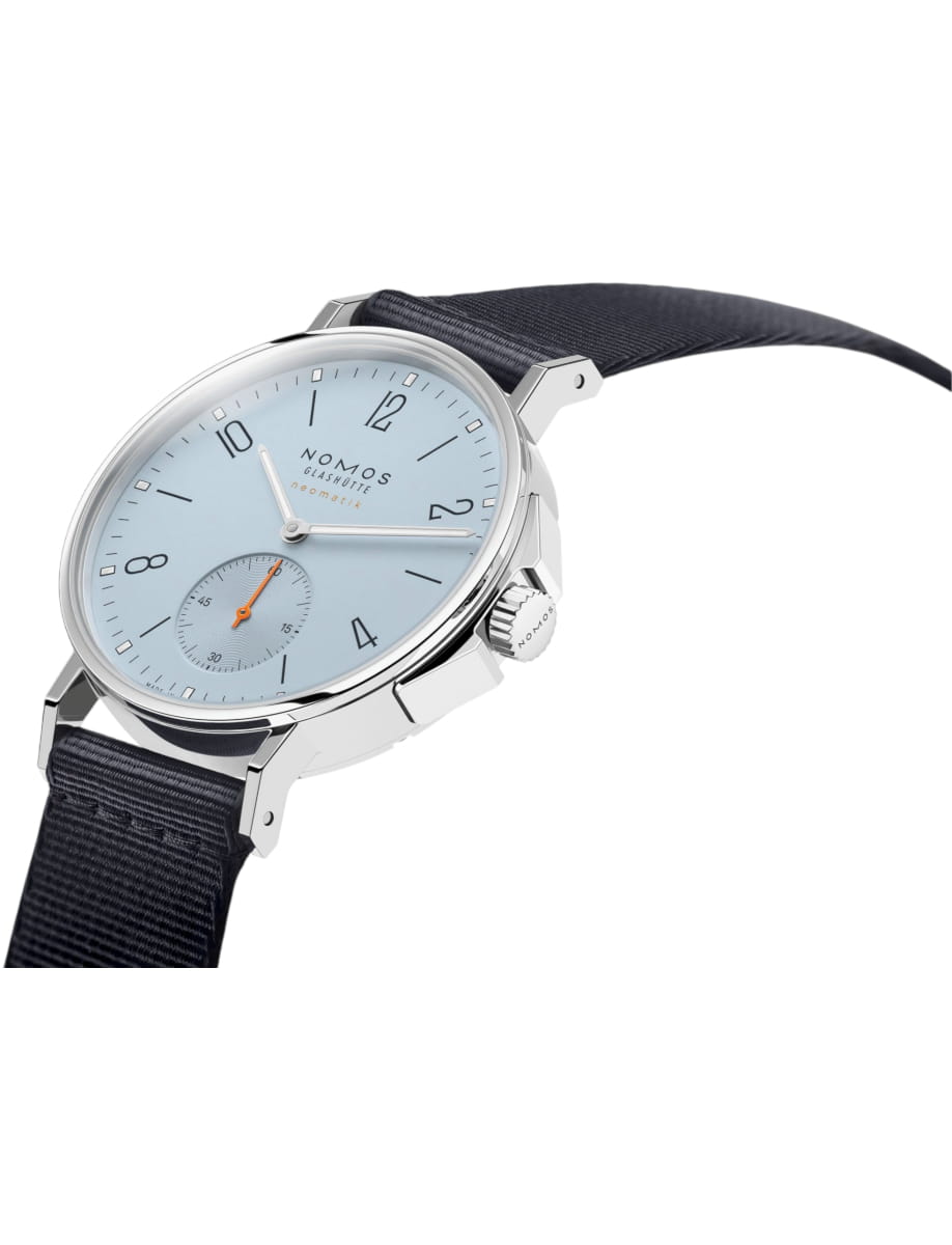 Side view of Nomos Glashutte wristwatch with stainless steel case, sky blue dial and blue textile strap