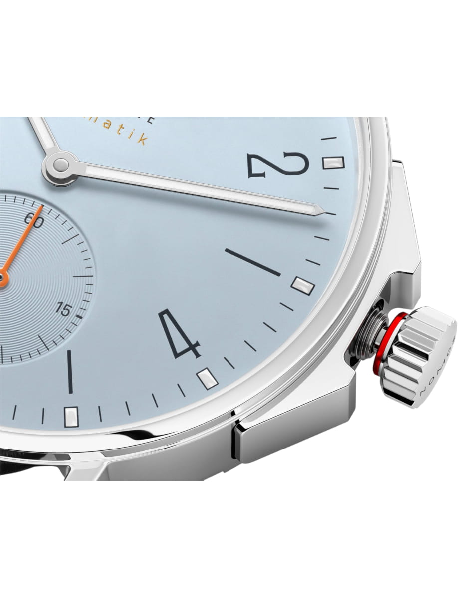 Close view of Nomos Glashutte wristwatch with stainless steel case and sky blue dial