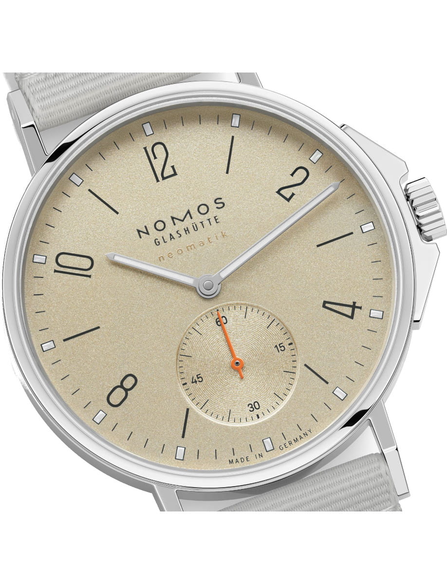Nomos Glashütte wristwatch with beige dial, silver case, and orange-seconds subdial at 6 o'clock