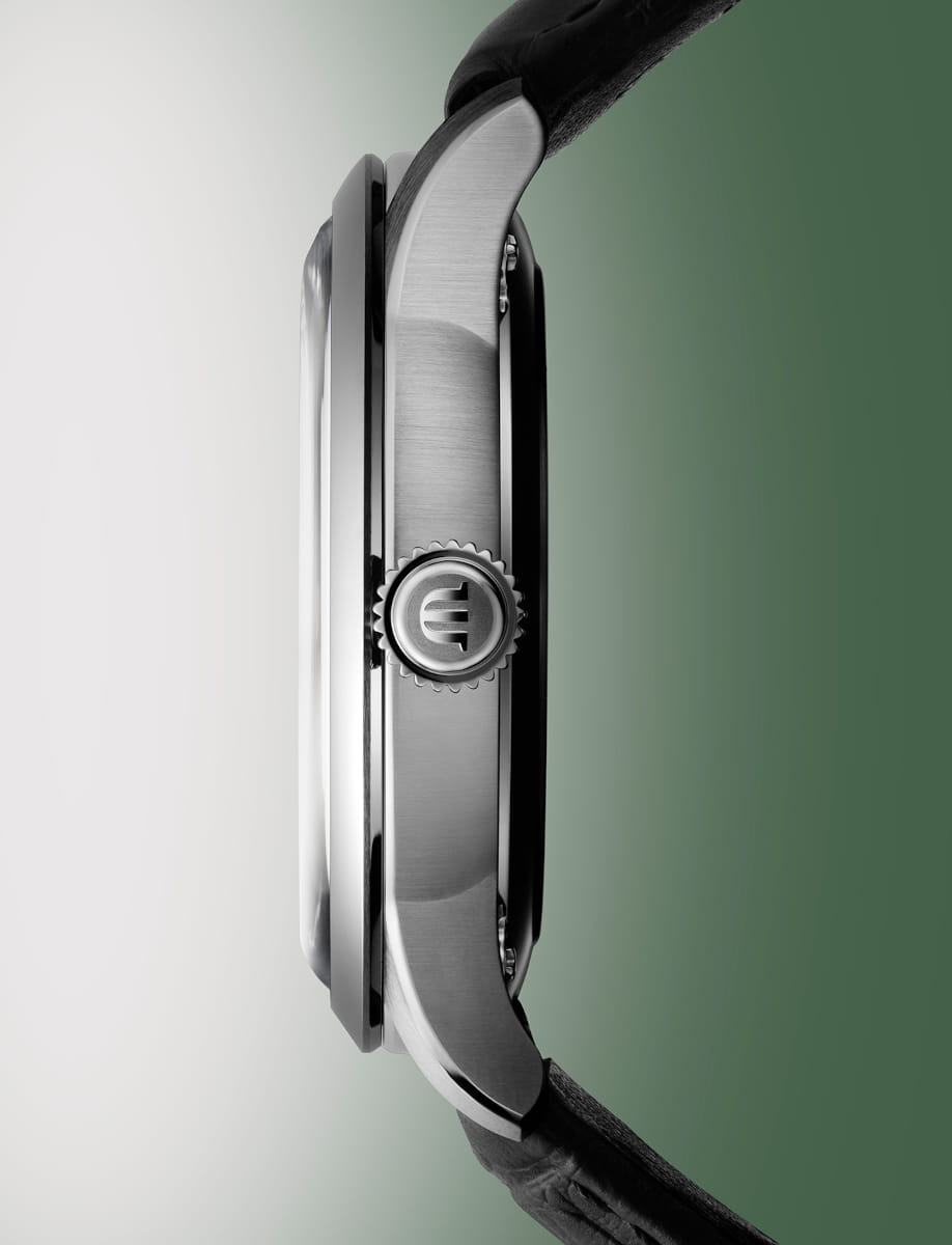 Side view of Maurice Lacroix 1975 Legacy wristwatch with stainless steel case, and black alligator-style leather strap with 4N “M” logo.