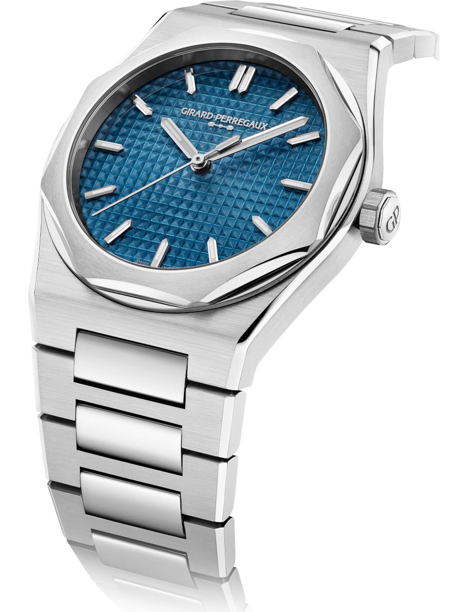 Side view of Girard Perregaux Laureato Fifty wristwatch with stainless steel case and bracelet, and blue dial.