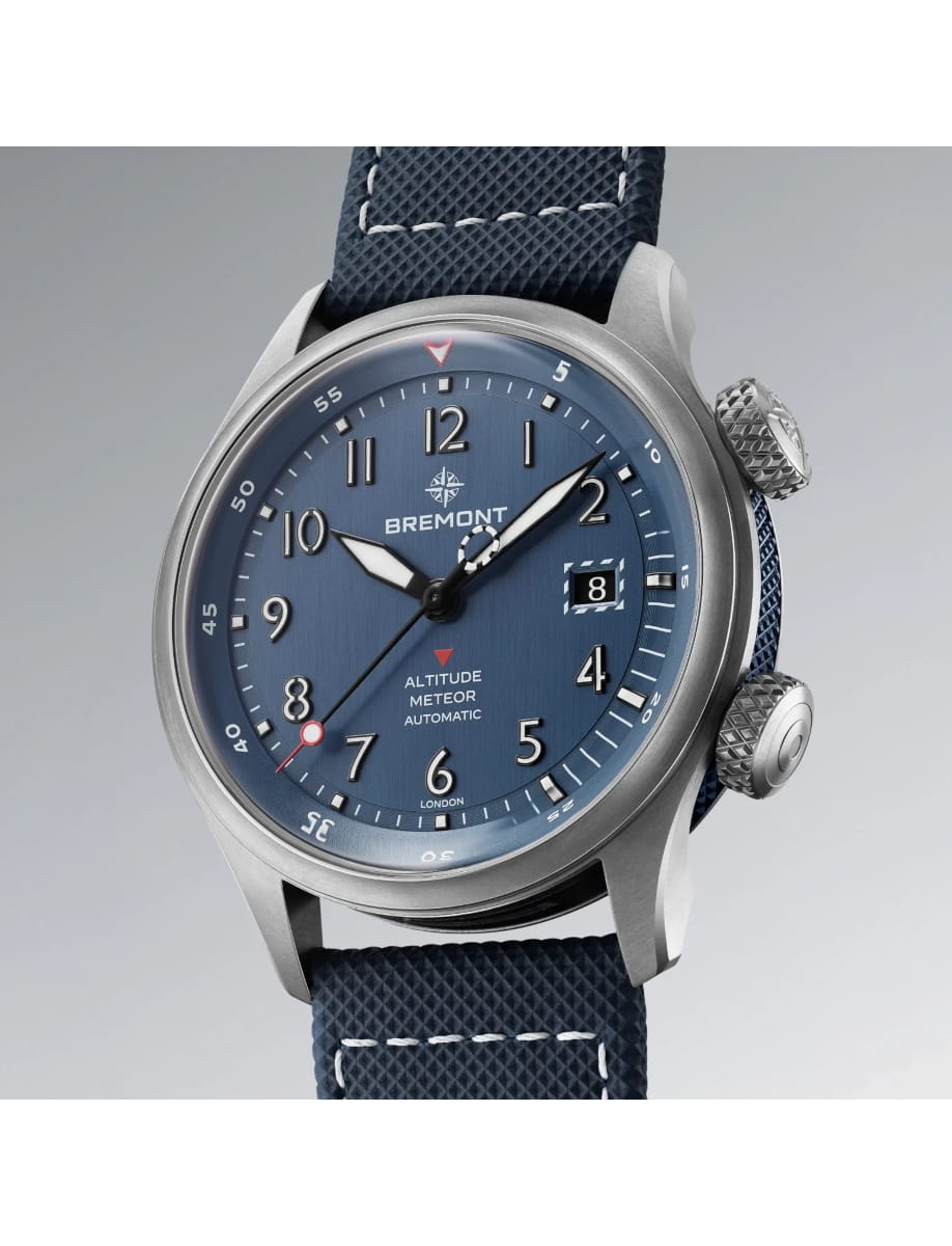 Side view of Bremont wristwatch with titanium case, blue dial, blue rubber and leather strap