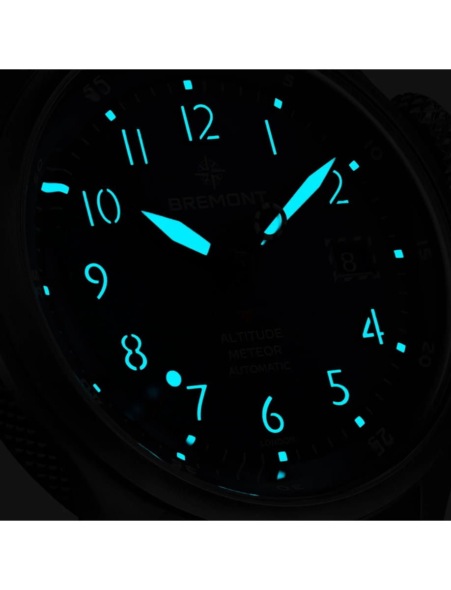 Night view of Bremont wristwatch with titanium case, blue dial and blue nato strap