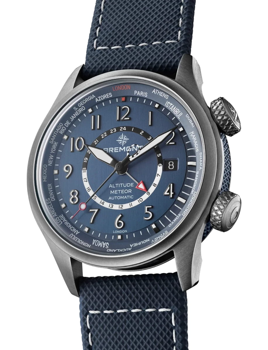 Side view of Bremont wristwatch with titanium case, blue dial, blue rubber and leather strap
