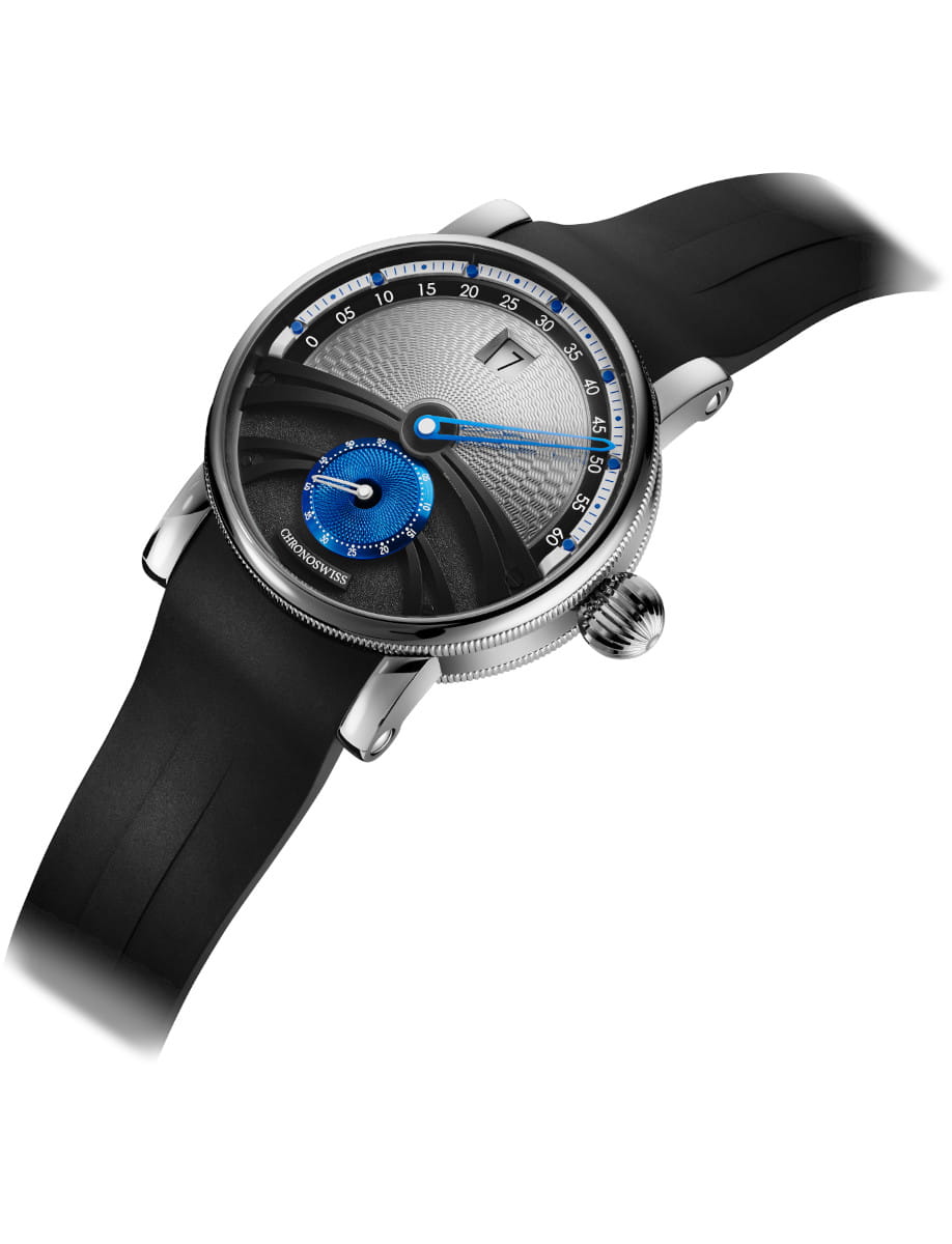 Side view of Chronoswiss wristwatch with titanium case, silver dial, and black rubber strap.