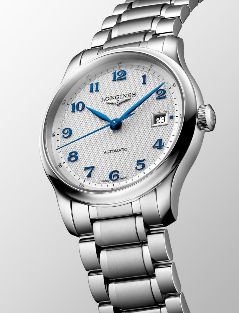 Side view of Longines Master Collection wristwatch with stainless steel case and bracelet, and silver dial.