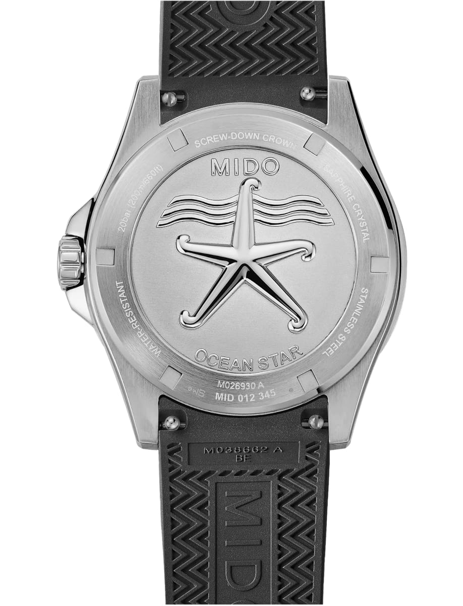 Back view of Mido wristwatch with stainless steel case, black dial and black rubber strap