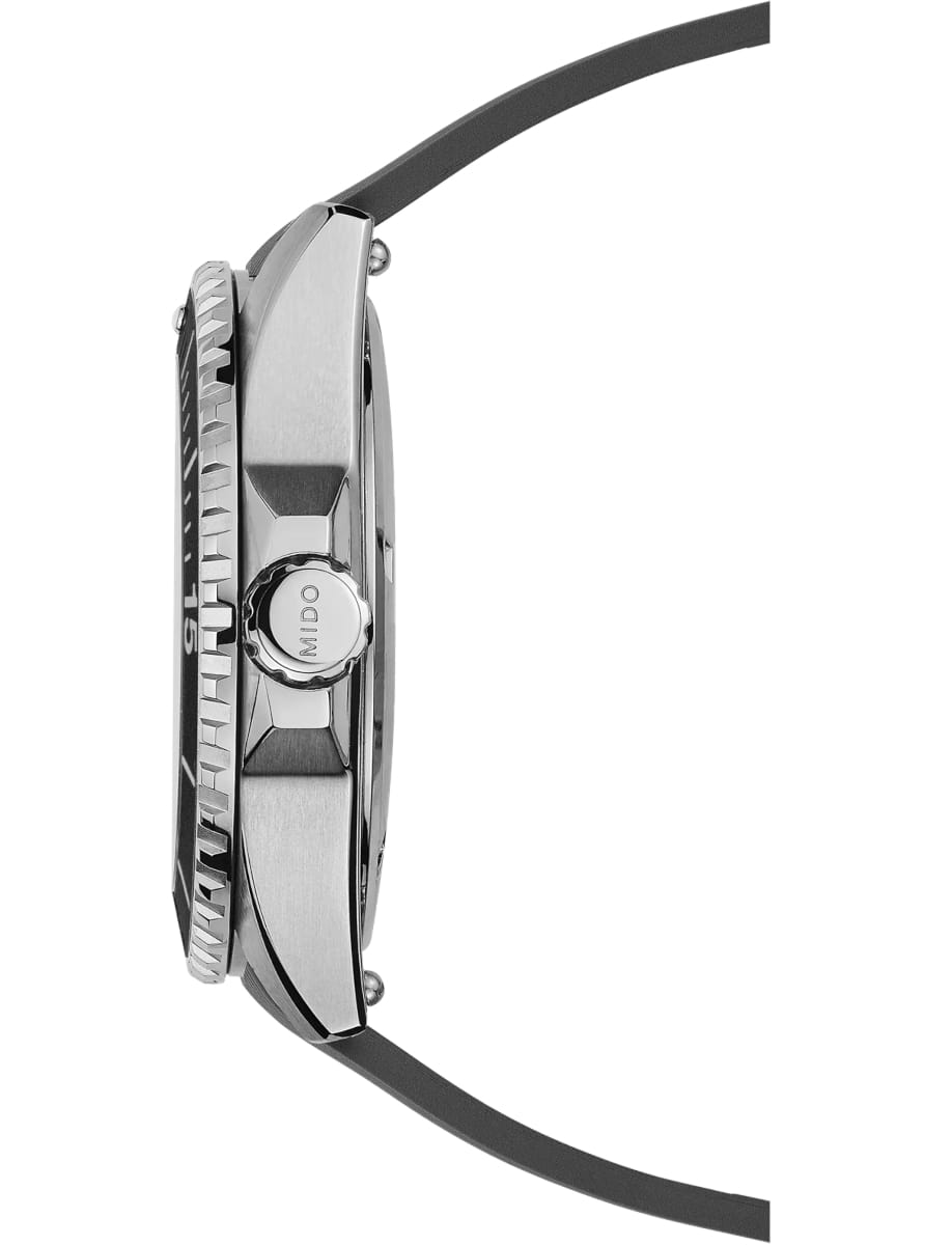 Side view of Mido wristwatch with stainless steel case, black dial and black rubber strap