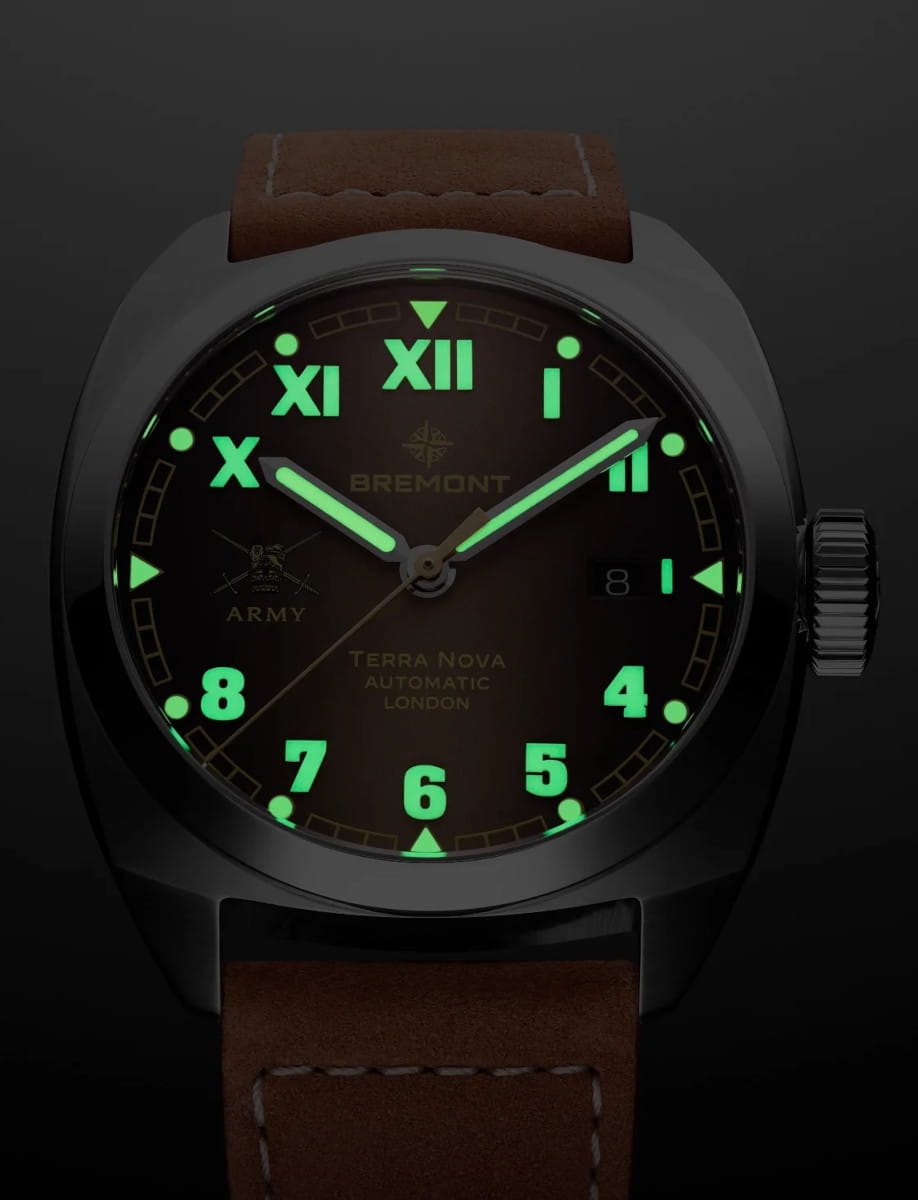 Night view of Bremont HMAF Terra Nova wristwatch with stainless steel case, gradient caramel California dial, and light brown Nubuck leather strap.