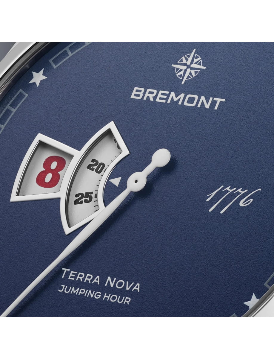 Close view of Bremont Terra Nova 40.5mm Jumping Hour 1776 wristwatch with stainless steel case and bracelet, and blue textured dial.