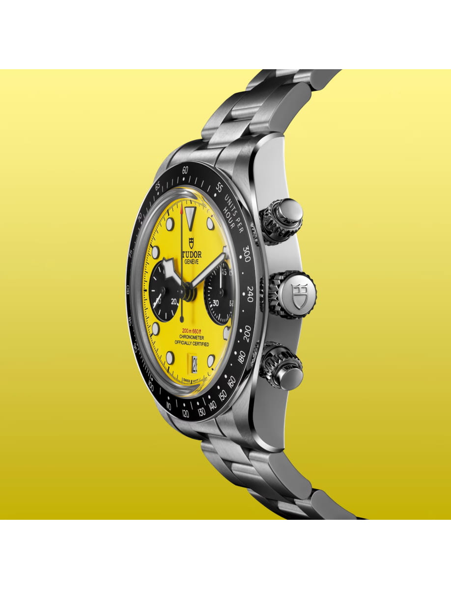 Side view of Tudor wristwatch with stainless steel case and bracelet and yellow dial