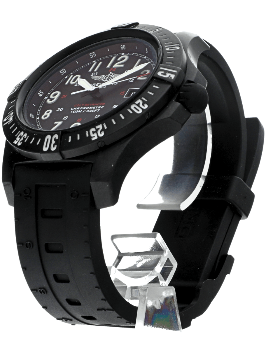 Black pre-owned Breilting watch with a large rotating bezel and a perforated rubber strap, shown from an angled side view.