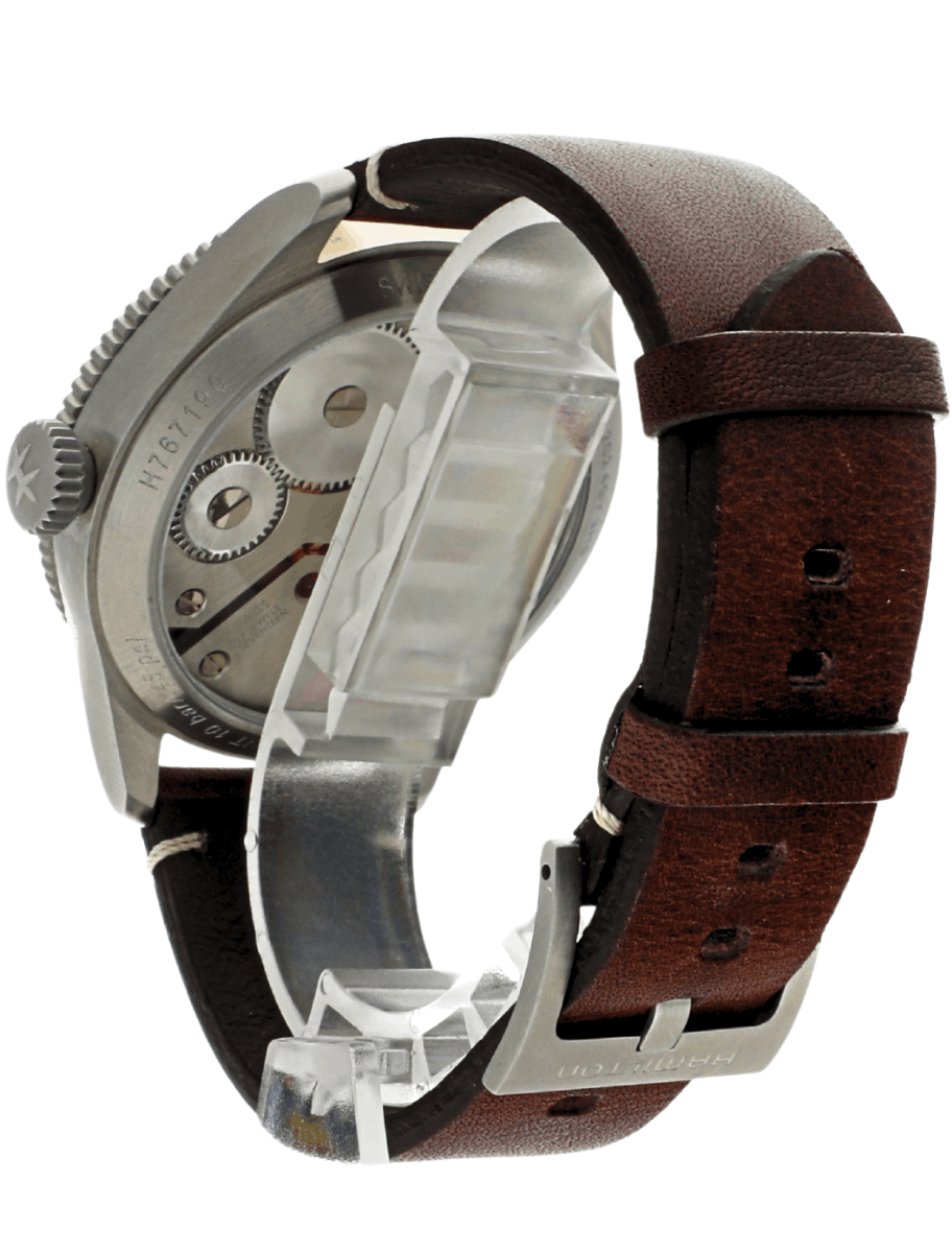 Hamilton pre-owned back view of a mechanical wristwatch with a transparent case exposing gears and movement, mounted on a brown leather strap