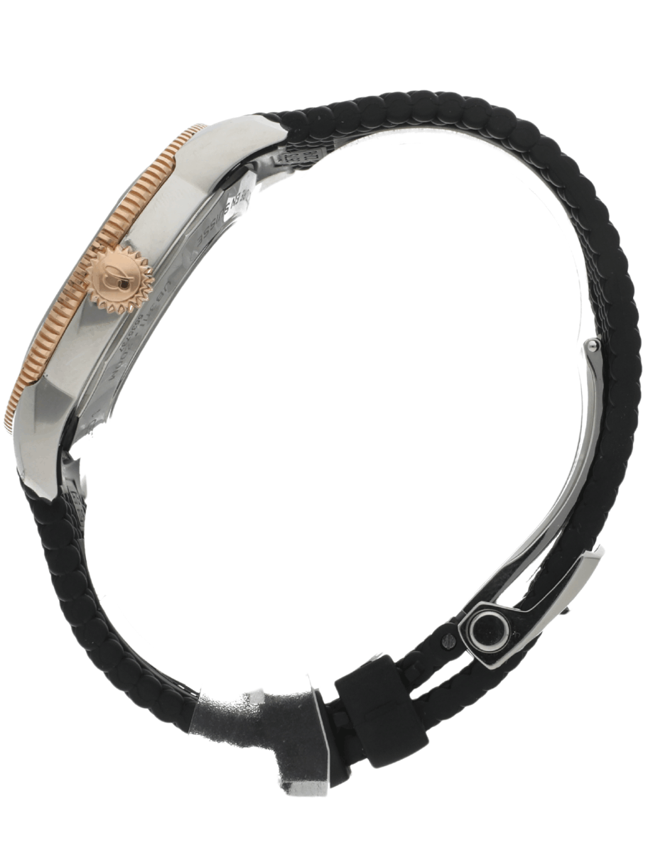 Side view of a wristwatch with a silver case, gold crown, and a black braided band