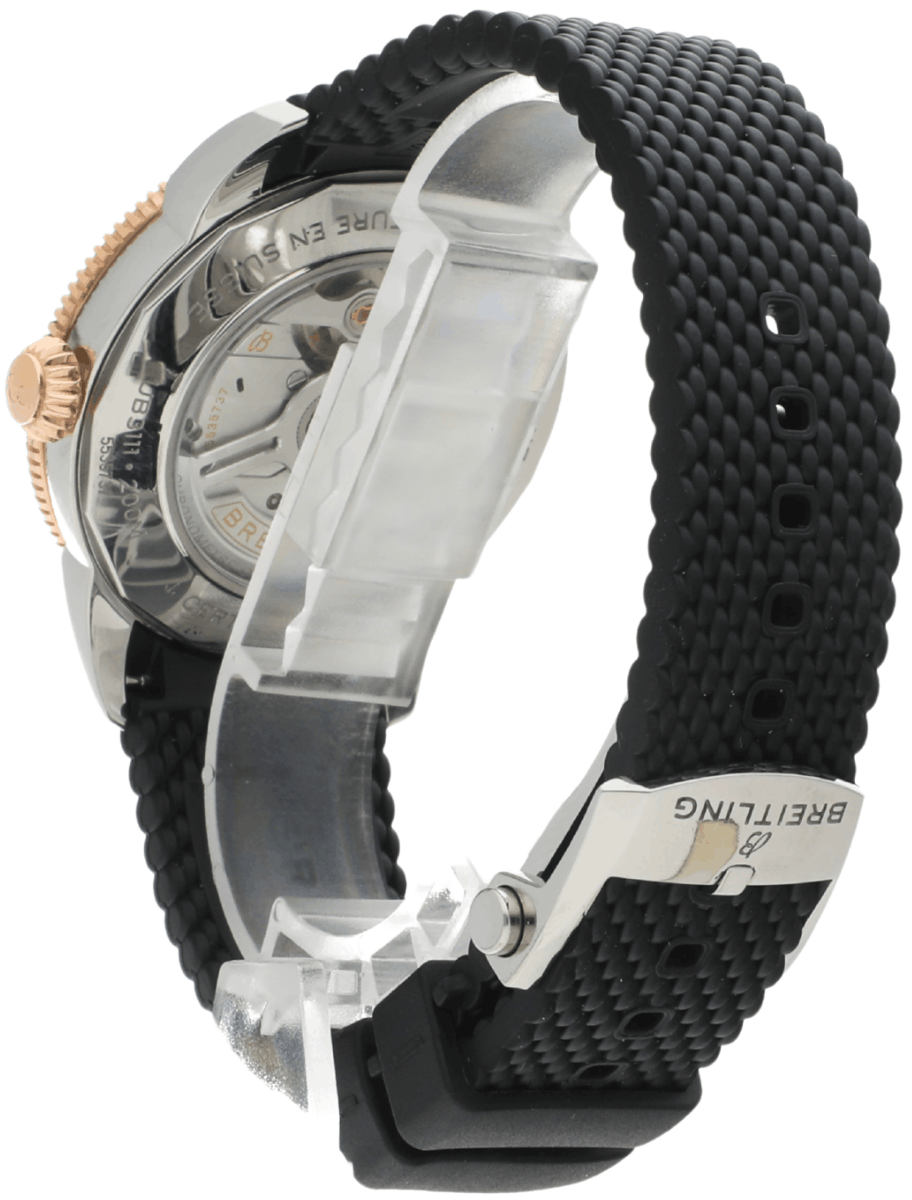 Breitling wristwatch with a black textured strap and visible metal caseback.
