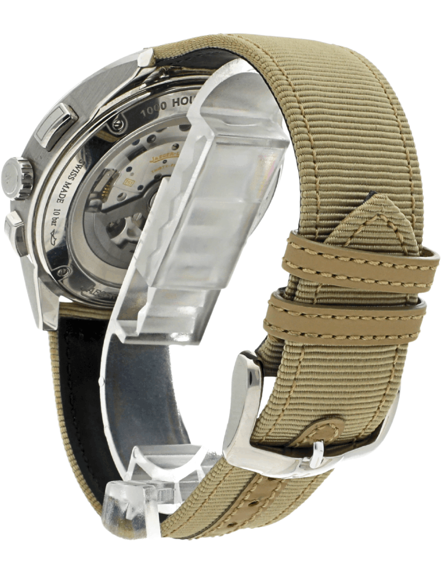 Back view of a silver wristwatch with a beige fabric strap, exposing its mechanical movement through a transparent case back, on a white background.