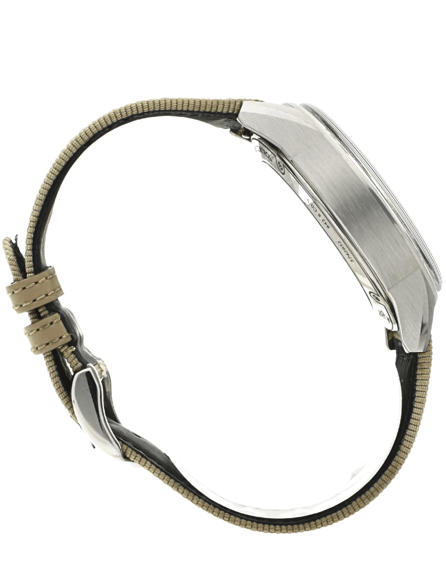 Side view of a wristwatch with a brushed metal case and beige fabric strap, showing the clasp and buckle.