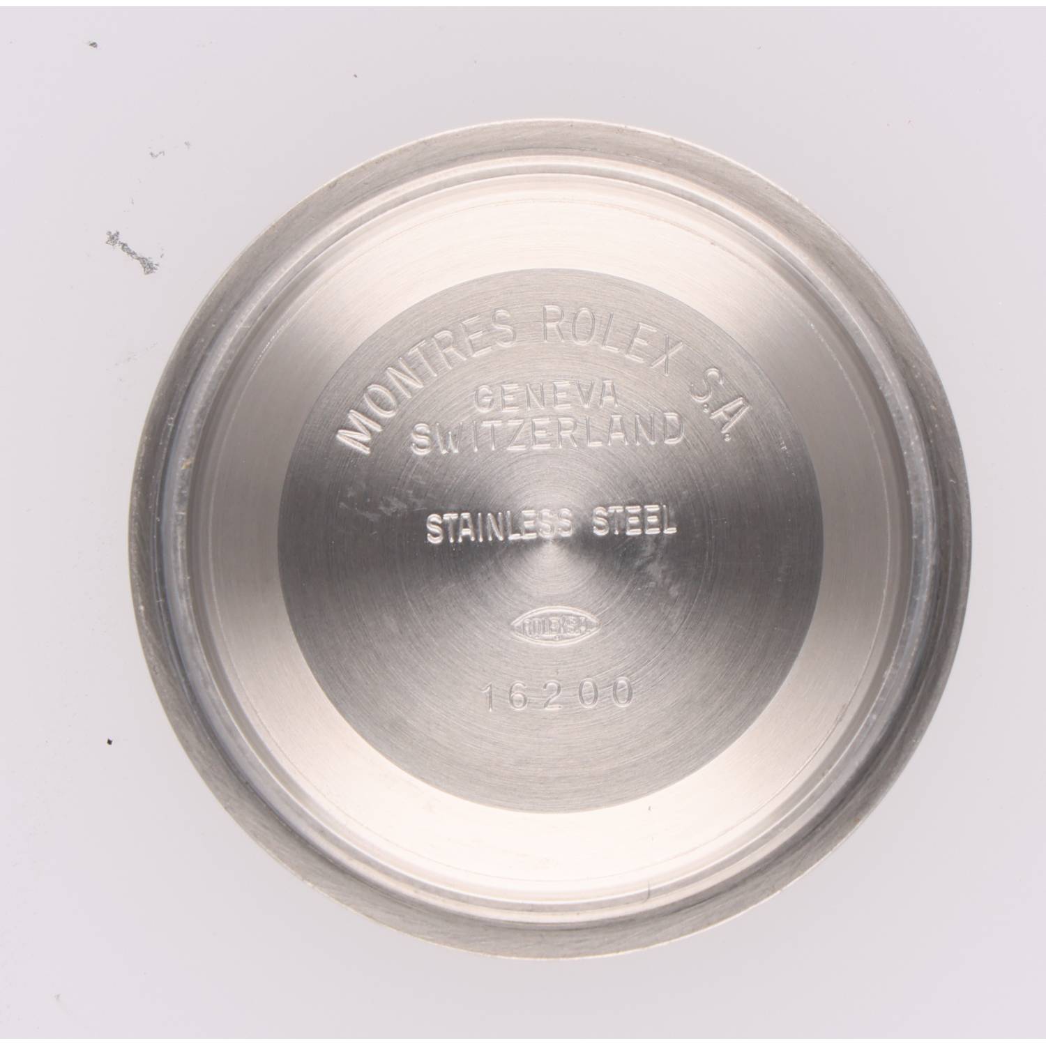 Stainless steel Rolex back case with engraving: MONITRES ROLEX S.A., GENEVA SWITZERLAND, 16200 (logo visible)