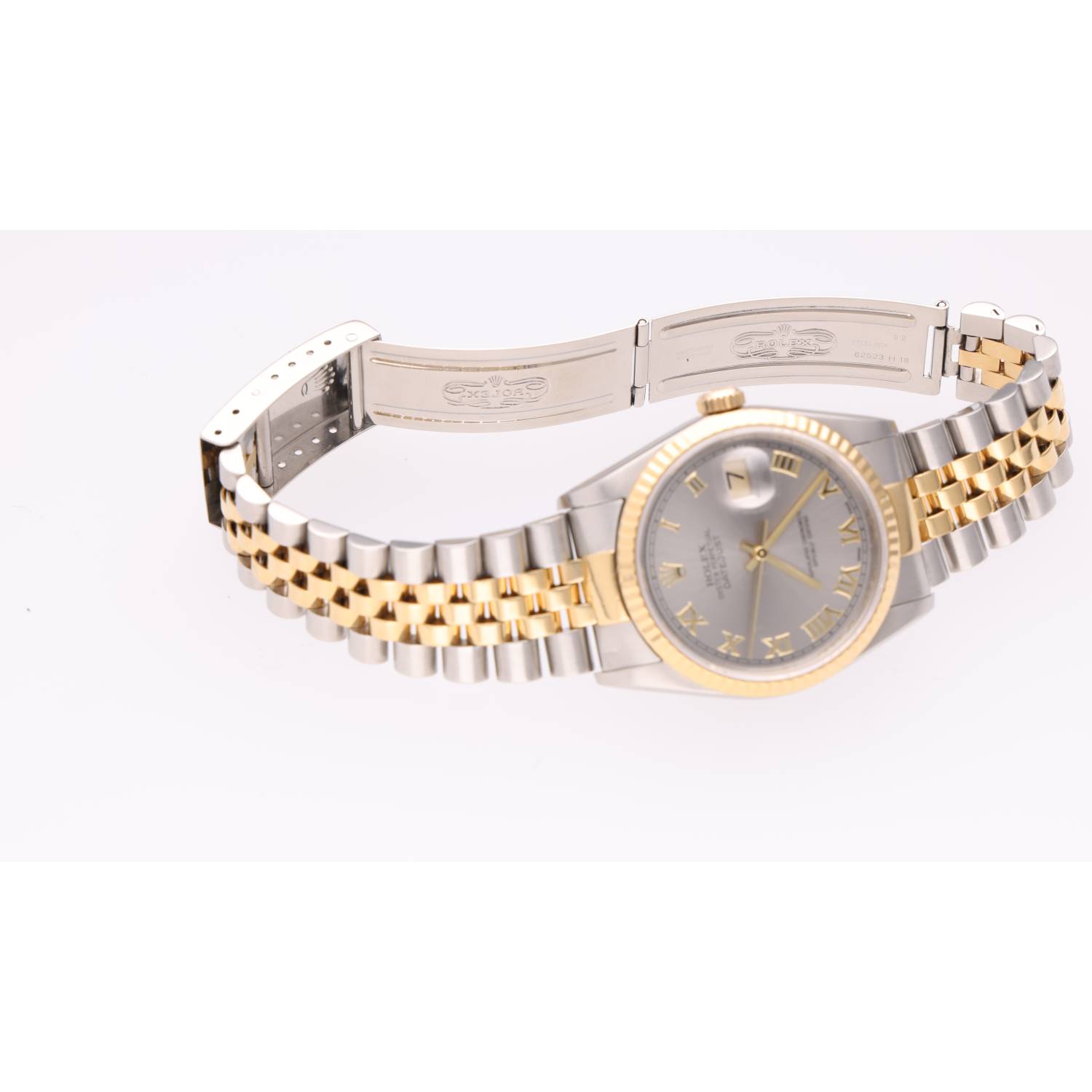 Two-tone Rolex watch with gold bezel and silver bracelet on a white background, date window visible at 3 o'clock.