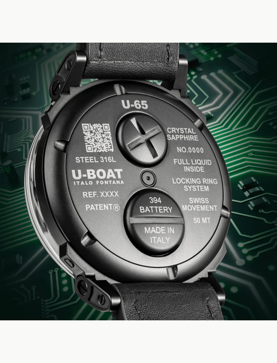 Close-up of a black U-Boat watch back with engravings: U-65, Crystal Sapphire, Made in Italy, 394 Battery, locking ring system, and barcode area.