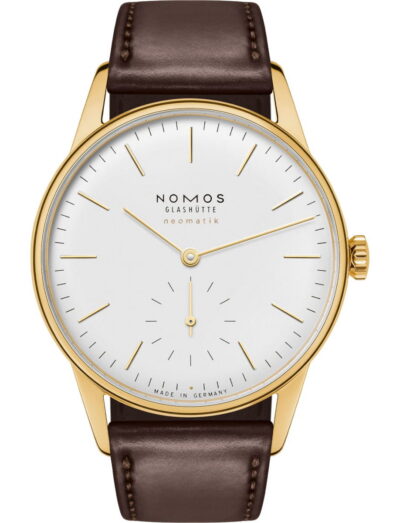 Gold Nomos Glashütte Neomatik wristwatch with a white dial, thin gold hands and baton markers, and a brown leather strap.