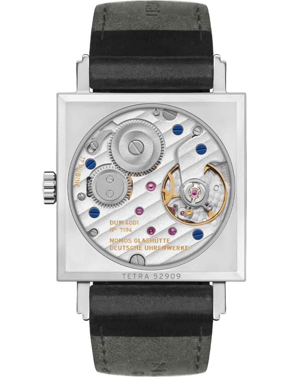 Square stainless steel wristwatch with a transparent back showing gears, blue screws, and a black leather strap.