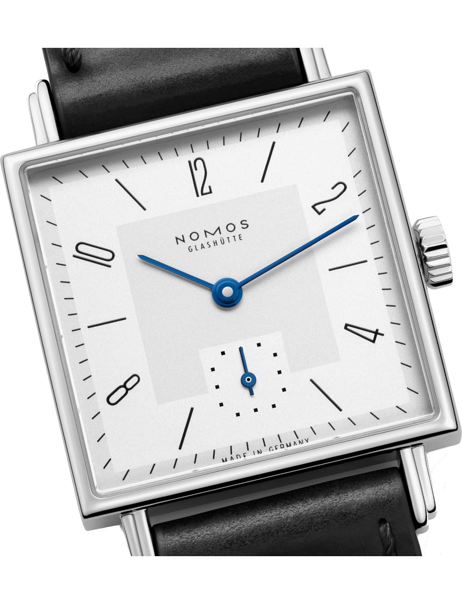 Nomos Glashütte square wristwatch with white dial, blue hands, and black hour markers on a black leather strap