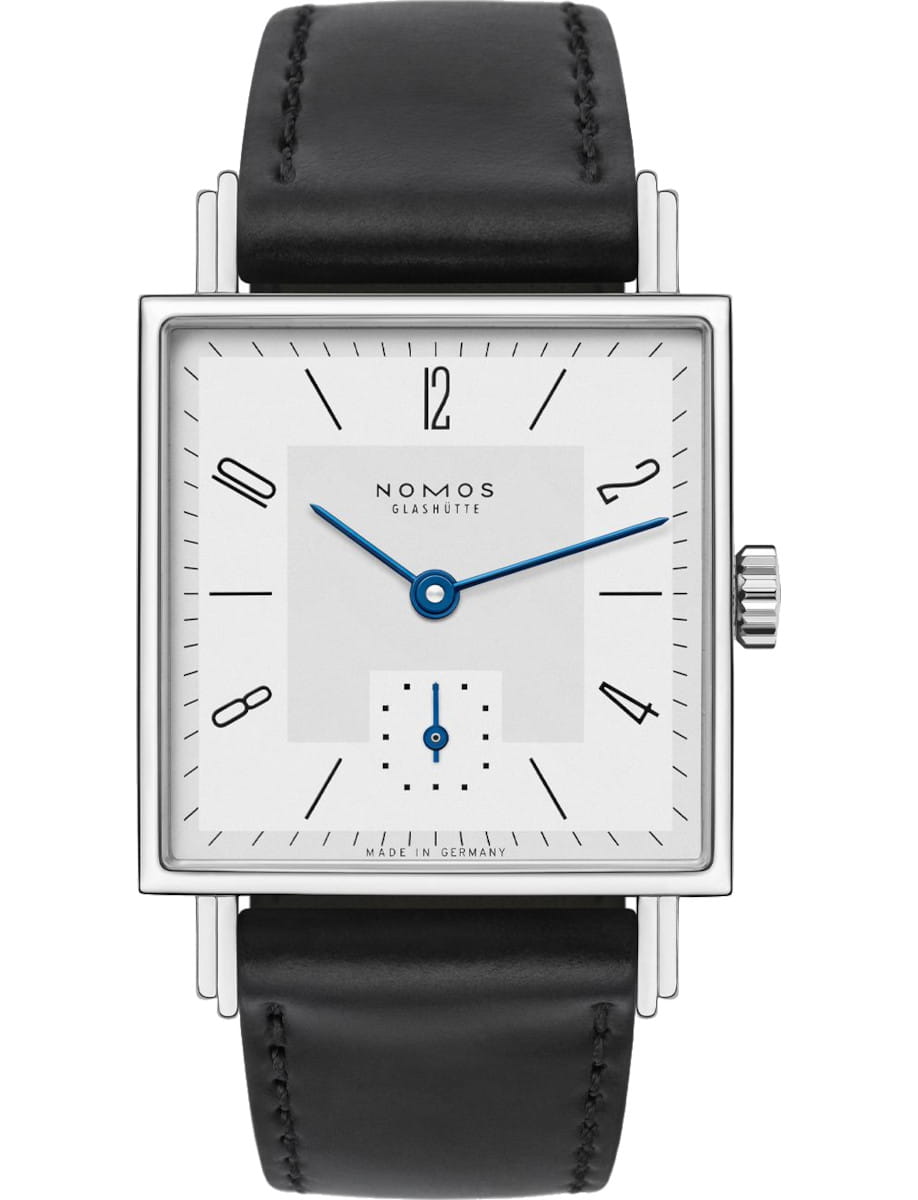 Square NOMOS Glashütte wristwatch with white dial, blue hands, small seconds subdial at 6, and a black leather strap.