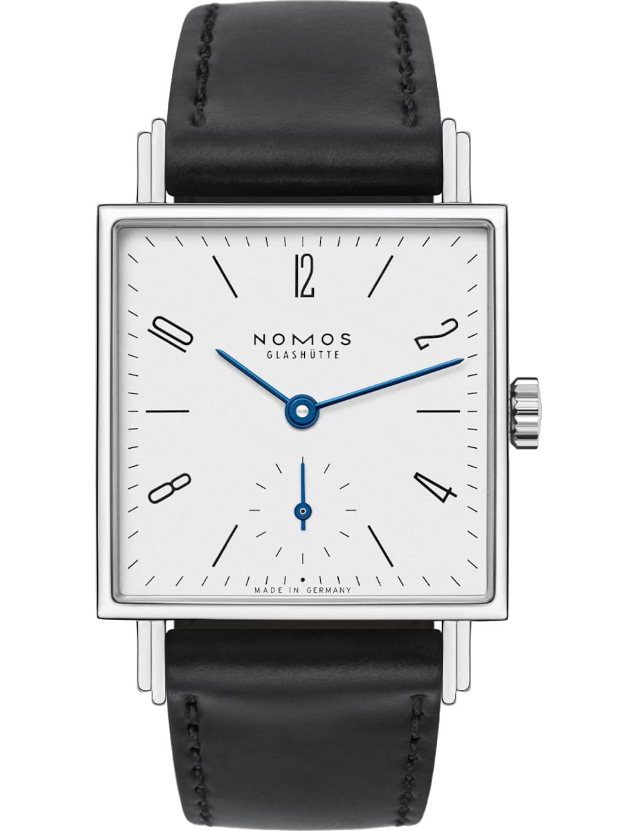 Square Nomos wristwatch with white dial, blue hands, and black Horween strap