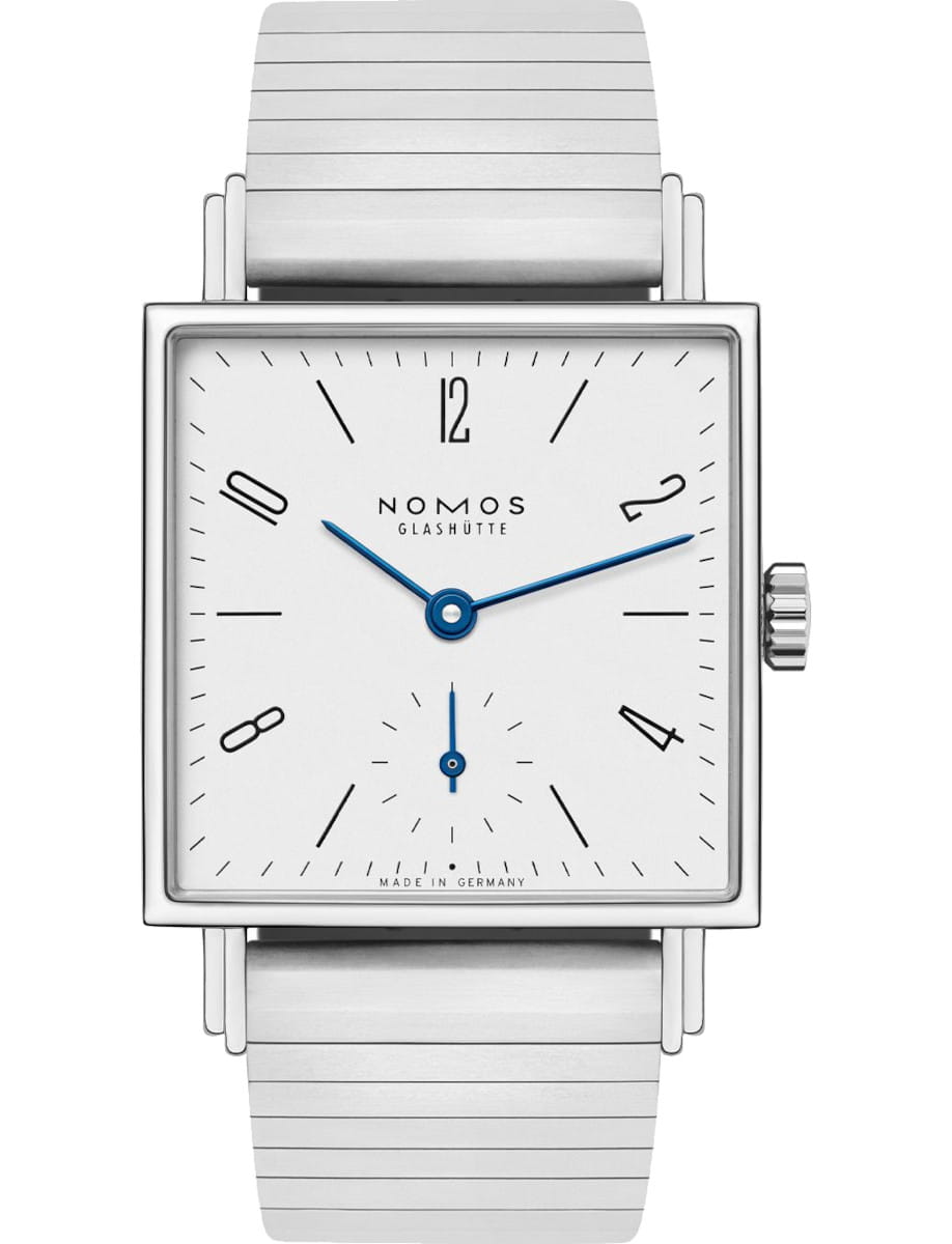Square-silver Nomos wristwatch with blue hands, minimalist dial, and a sport bracelet.