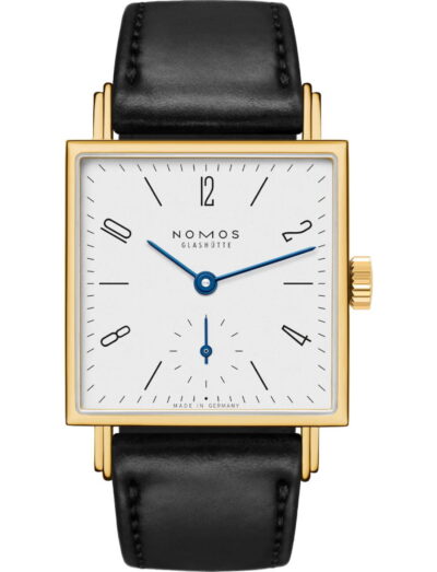 Gold rectangular wristwatch with white dial, blue hands, and black leather strap | Feldmar Watch Co. Gold rectangular wristwatch with white dial, blue hands, and black leather strap