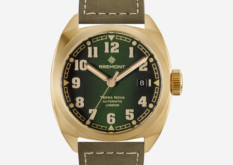 Gold-toned Bremont Terra Nova automatic watch with green dial and olive strap, displaying date at 3 o'clock.