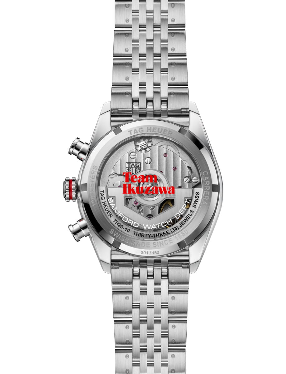 Stainless steel TAG Heuer watch seen from the back, with transparent caseback showing gears and the red 'Team Ikuzawa' text across them.
