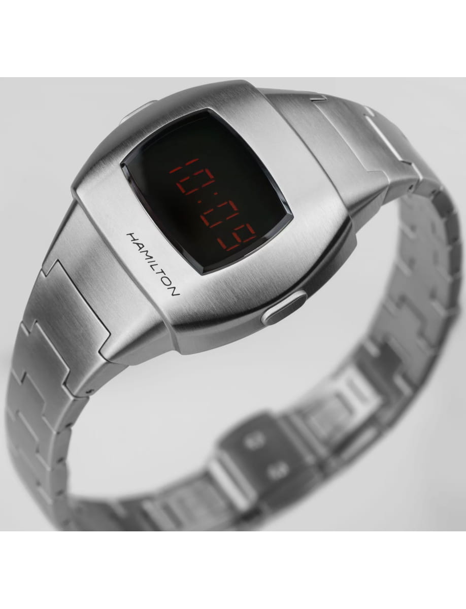Silver digital wristwatch with a metal link band and red LED time display; brand Hamilton etched on the case side of the watch.