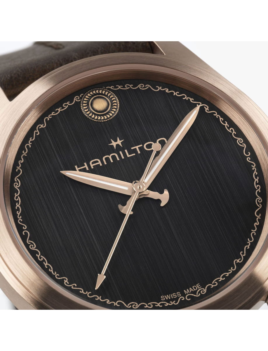 Close view of Hamilton wristwatch with bronze case, black dial and calf leather strap