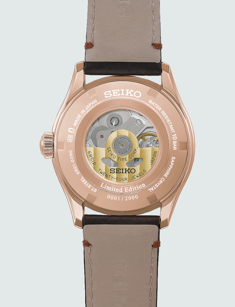 Rose-gold colored stainless steel Seiko watch back with a transparent case showing the movement; Limited Edition 0001/2000, sapphire crystal, leather strap.