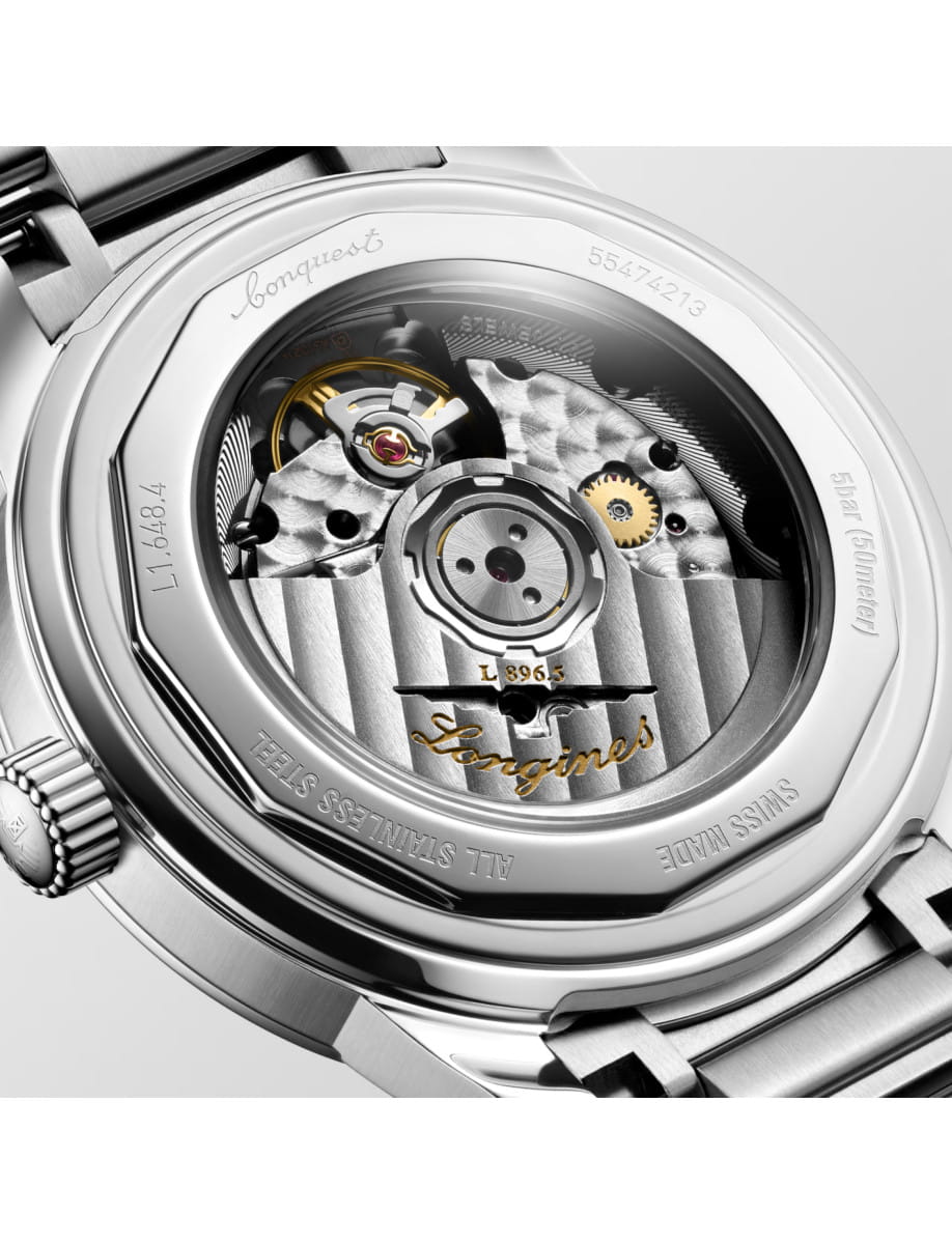 Back view of Longines Conquest Heritage Central Power Reserve wristwatch with stainless steel case and bracelet, and light blue opaline dial.