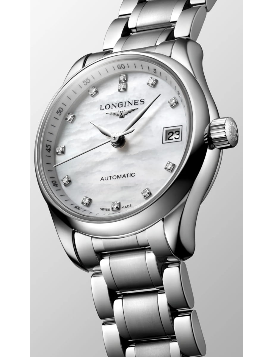 Close-up of a silver Longines automatic wristwatch with a mother-of-pearl dial, diamond hour markers, and a date display at 3 o'clock.